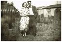 Mom_and_Dad_in_front_of_prefabs.jpg