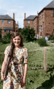 Doreen_Adams_with_WWII_kit_-_Rear_Garden_Of_55_Macmillan_Rd_Rowley_Village_png~1.jpg